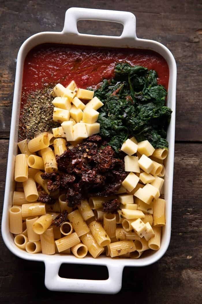 overhead prep photo of One Pan 4 Cheese Sun-Dried Tomato and Spinach Pasta Bake before baking