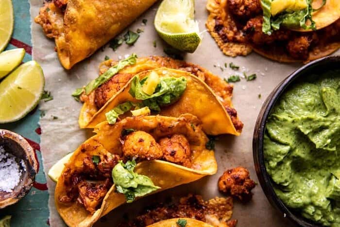 Crispy Cauliflower Tinga Tacos with Honey Lime Avocado Crema | halfbakedharvest.com overhead horizontal photo of Crispy Cauliflower Tinga Tacos