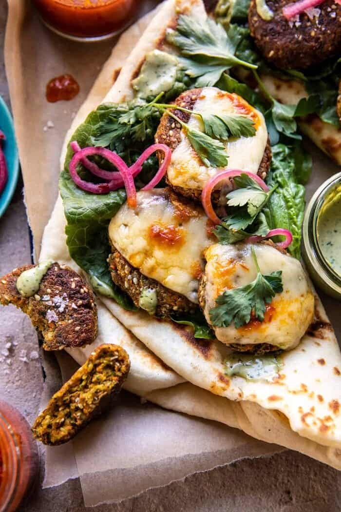 Crispy Sesame Falafel Melts with Garlicky Green Tahini | halfbakedharvest.com overhead close up photo of Crispy Sesame Falafel Melts with Garlicky Green Tahini