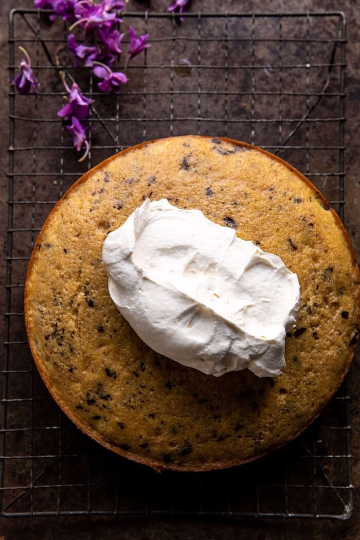prep photo of Vanilla Tiramisu Cake after baking with a dollop of frosting on top