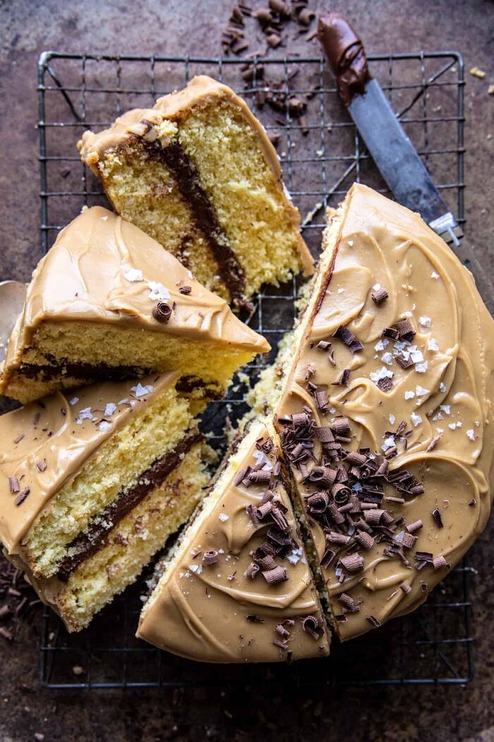 New! Old School style Caramel Butter Cake with Fudgy Chocolate Frosting. Every bite is sweet, salty, extra chocolatey, and truly delicious. Recipe: https://body-metrics.site/caramel-butter-cake/ overhead photo of Caramel Butter Cake with Fudgy Chocolate Frosting