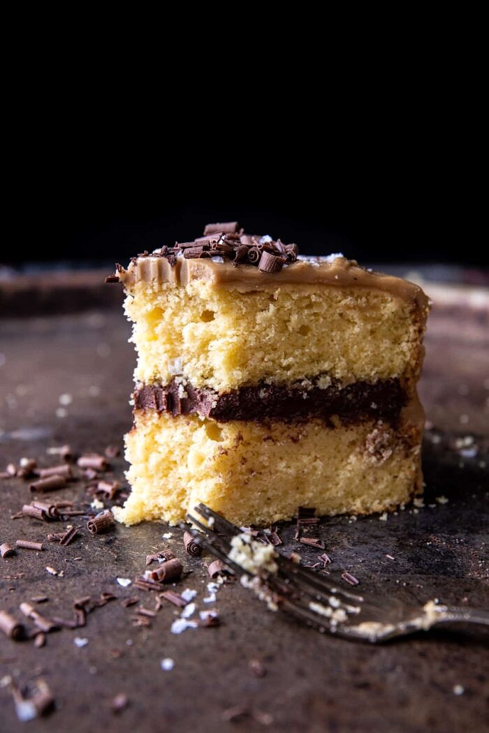 Caramel Butter Cake with Fudgy Chocolate Frosting | halfbakedharvest.com Caramel Butter Cake with Fudgy Chocolate Frosting with bite taken out of cake