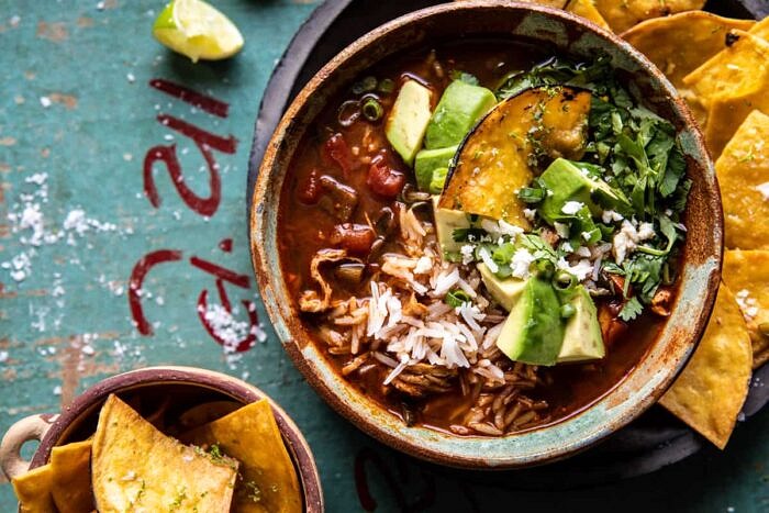 Slow Cooker Chipotle Chicken and Avocado Rice Soup | halfbakedharvest.com overhead horizontal photo of Slow Cooker Chipotle Chicken and Avocado Rice Soup
