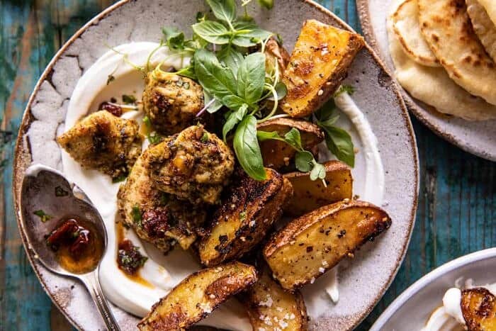overhead photo of Sheet Pan Pesto Chicken and Lemon Butter Potatoes with Whipped Feta 