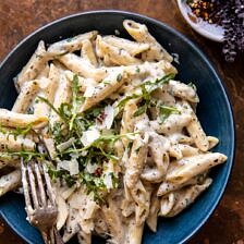 One Pot Creamy Penne Alfredo with Spicy Arugula | halfbakedharvest.com