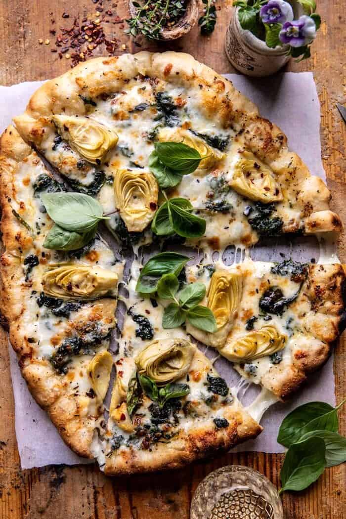 Spinach and Artichoke Pizza with Cheesy Bread Crust | halfbakedharvest.com