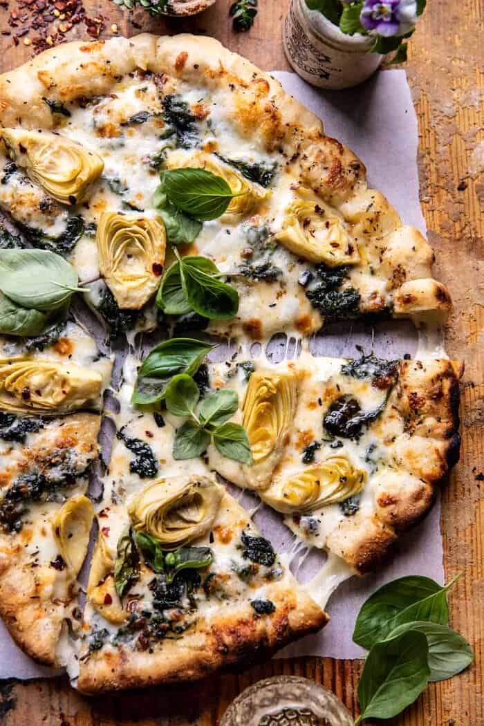 Spinach and Artichoke Pizza with Cheesy Bread Crust | halfbakedharvest.com