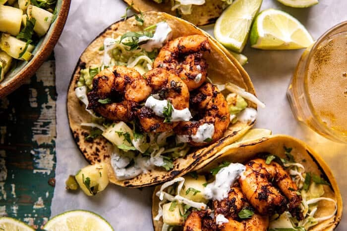Sheet Pan Jalapeño Pineapple Shrimp Tacos with Cilantro Garlic Sauce | halfbakedharvest.com