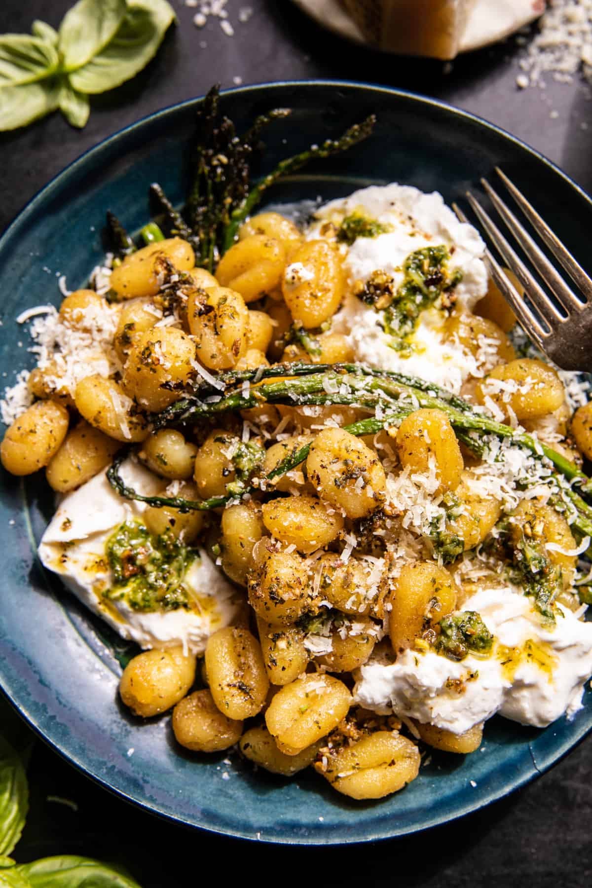 gnocchi in bowl with butter and burrata, asparagus,