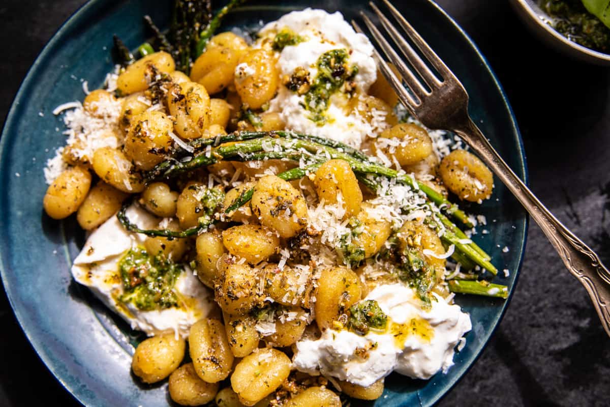 gnocchi in bowl with burrata and fork