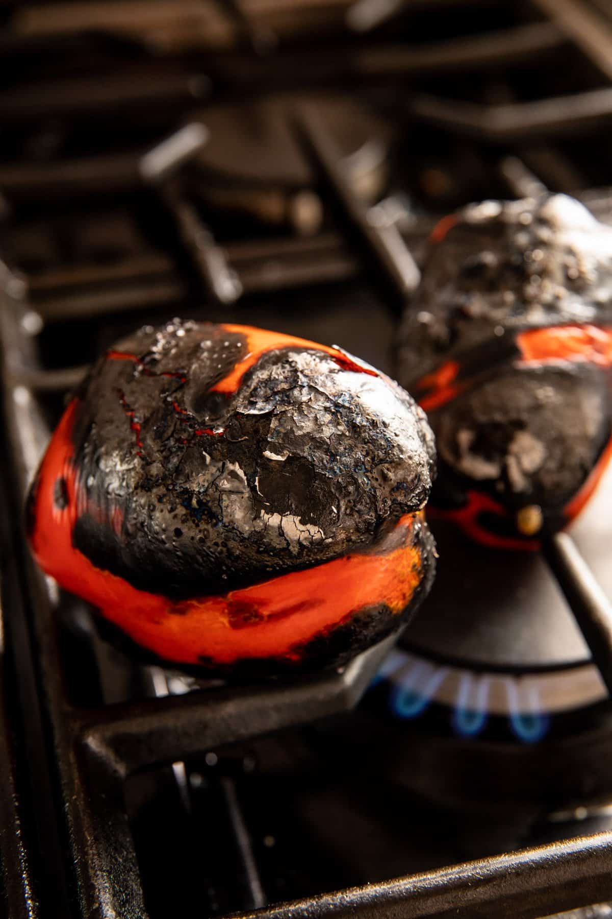 red pepper roasting on open flame
