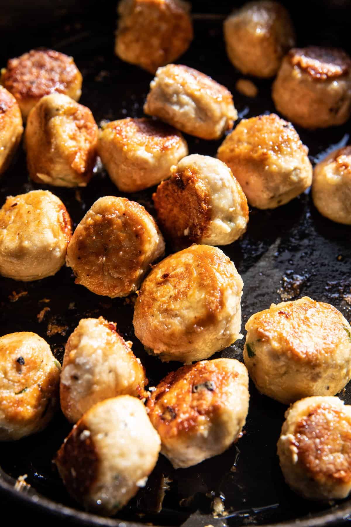 meatballs cooking in skillet