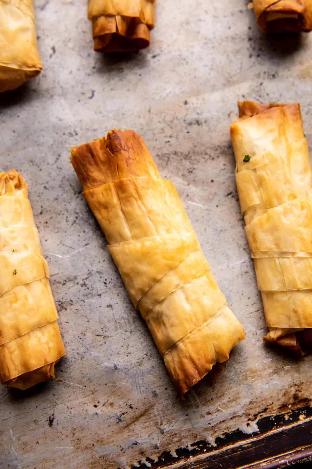 feta rolls on baking sheet after baking 