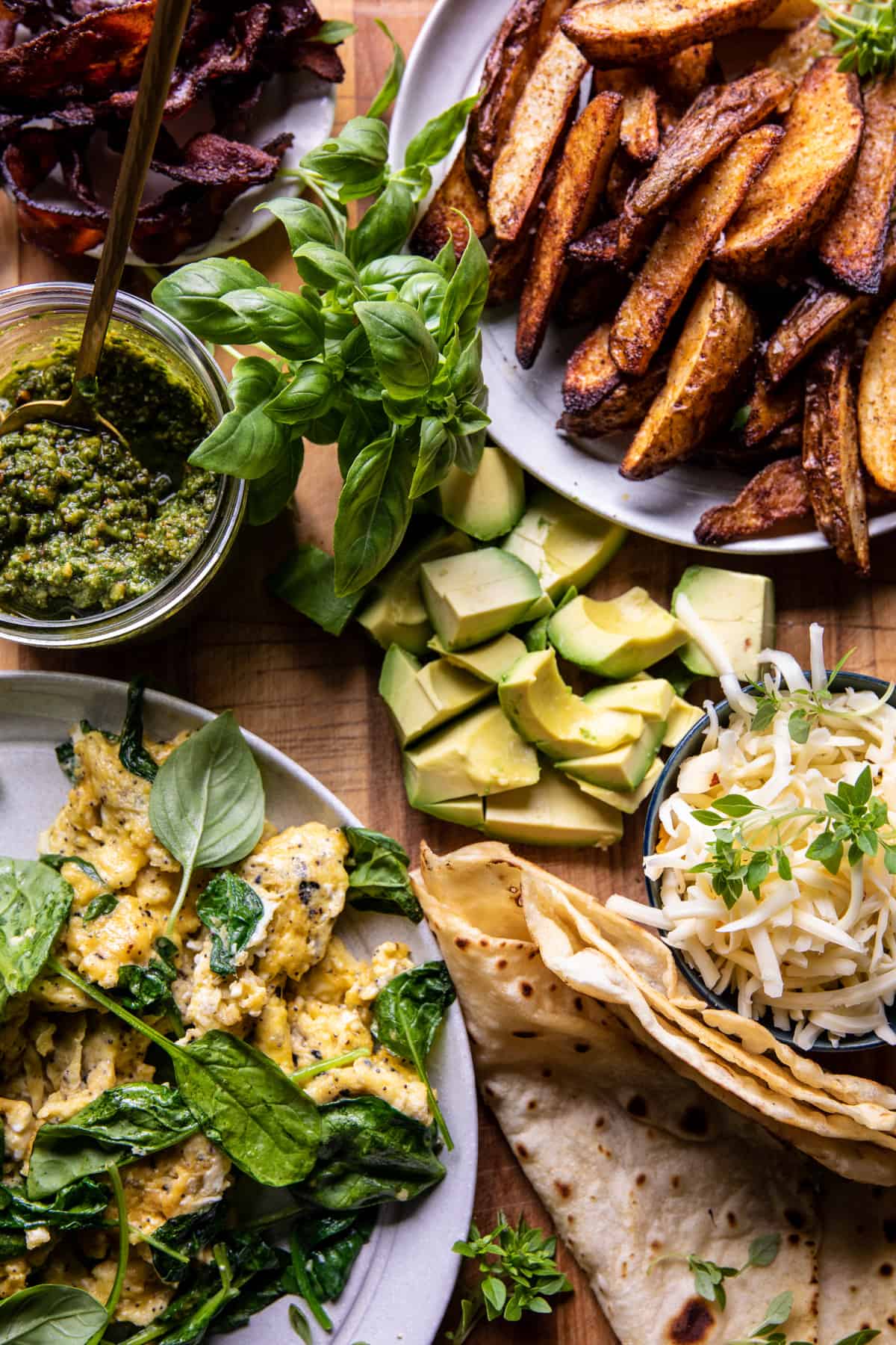 Cheesy Pesto Avocado Bacon Breakfast Burrito | halfbakedharvest.com