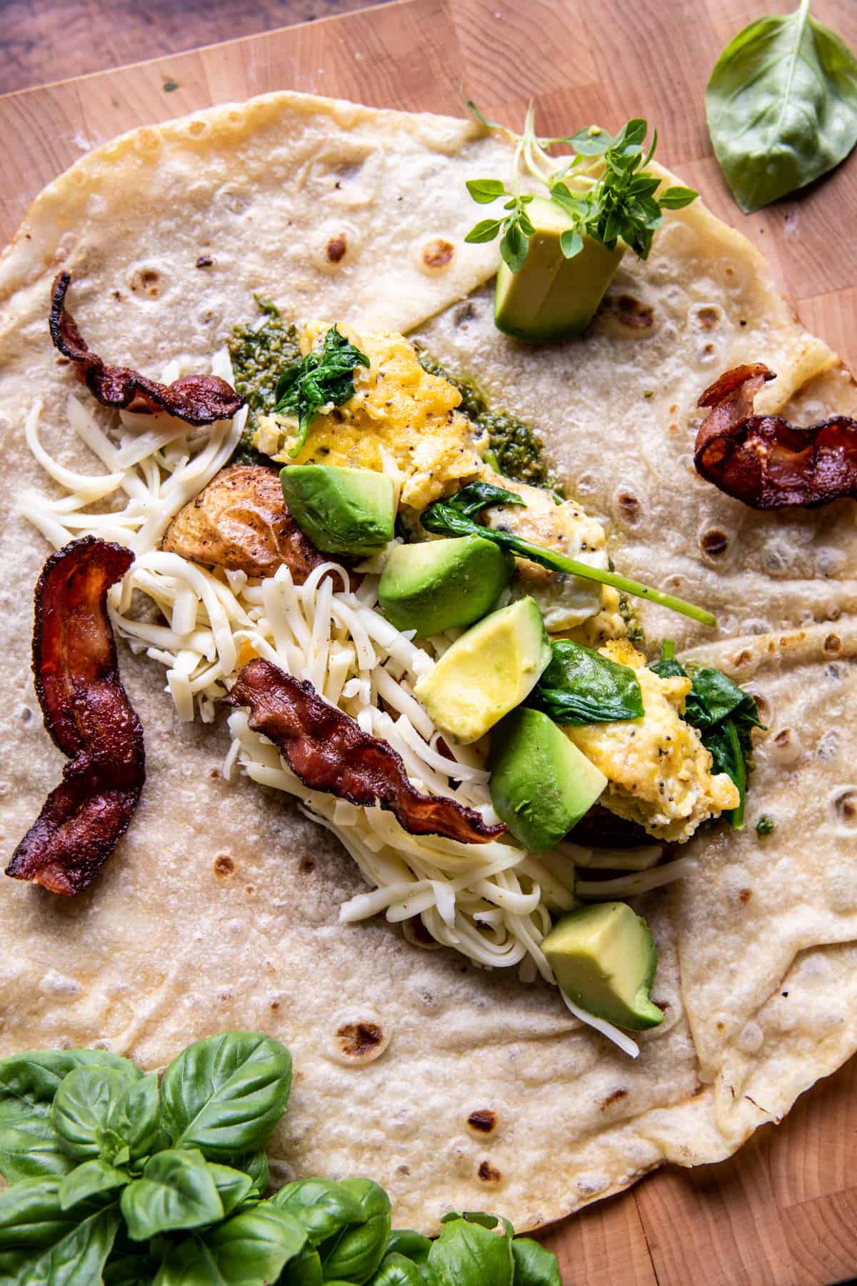 Cheesy Pesto Avocado Bacon Breakfast Burrito | halfbakedharvest.com