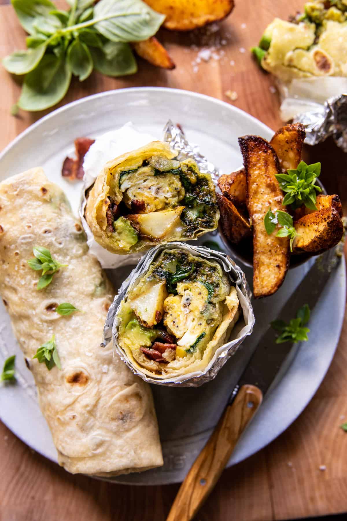Cheesy Pesto Avocado Bacon Breakfast Burrito | halfbakedharvest.com