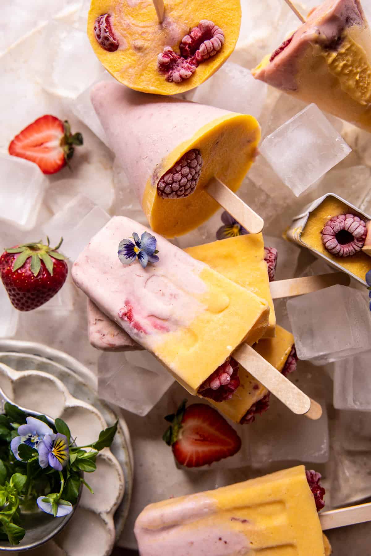 Creamy Strawberry Mango Popsicles | halfbakedharvest.com