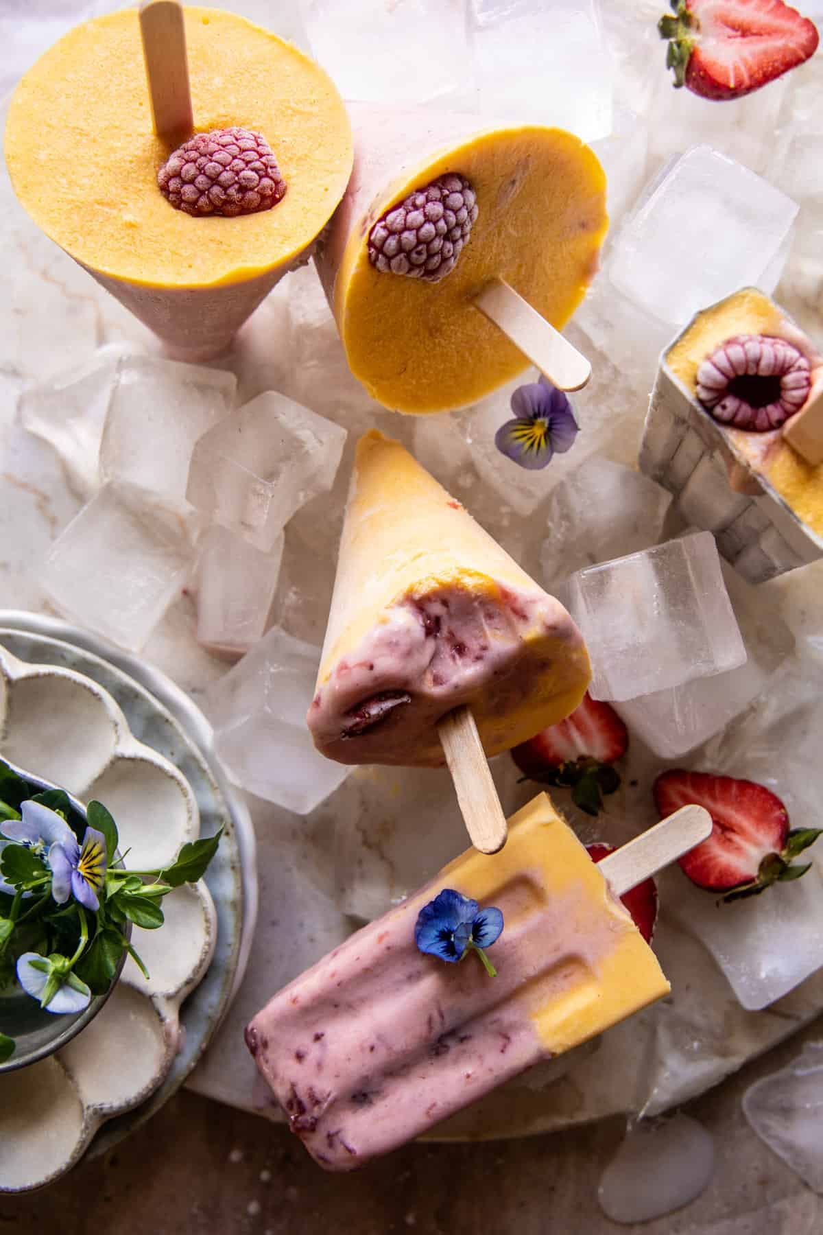 Creamy Strawberry Mango Popsicles | halfbakedharvest.com